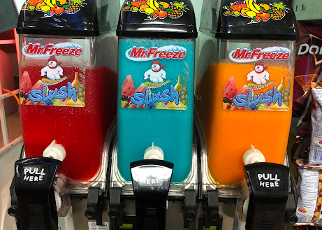 Mr. Freeze slush machines in red, blue and orange flavours